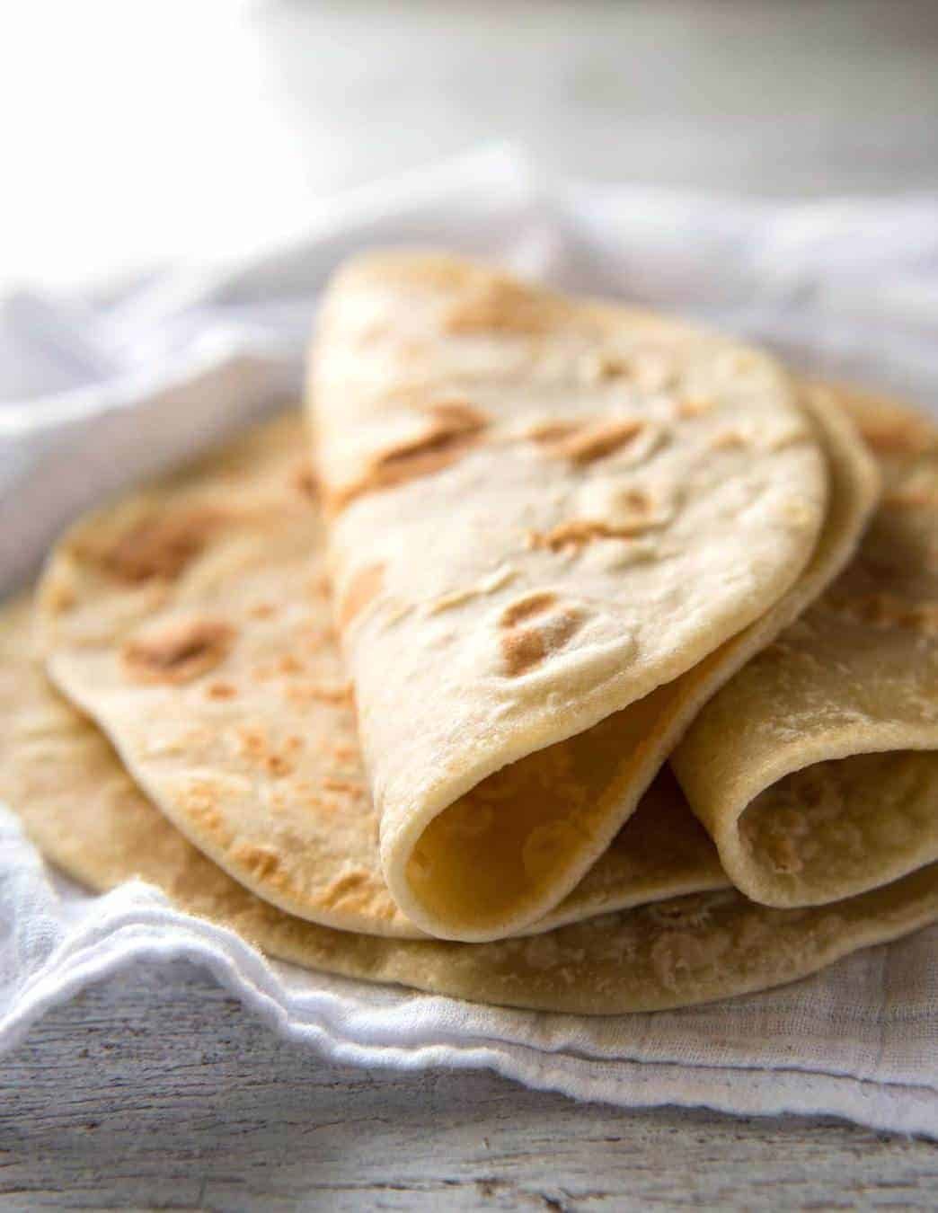 This flatbread recipe is made without yeast, yet is soft and pliable and wonderfully moist. www.recipetineats.com