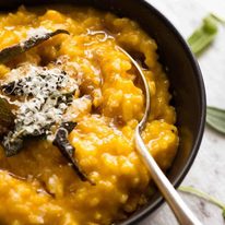Close up of spoon in a bowl with Creamy Baked Pumpkin Risotto