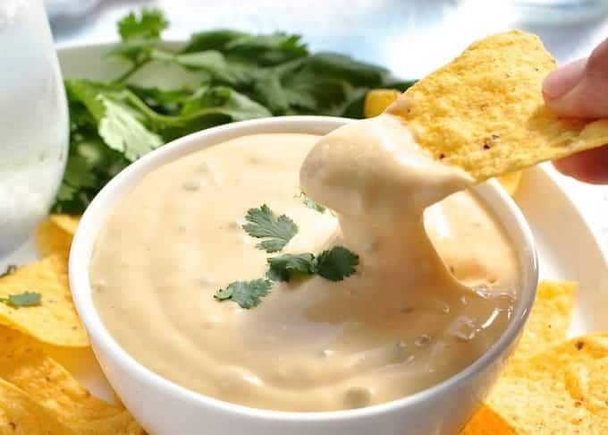 Nachos Cheese Dip that stays silky smooth even when it cools! Just 5 min to make, without using processed cheese! recipetineats.com