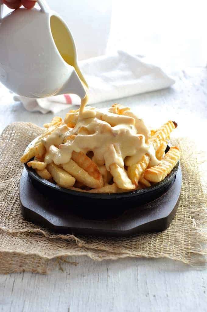 Nachos Cheese Dip & Sauce that does not harden when cooled, and doesn't split when reheated. Just 5 min to make, without using processed cheese! recipetineats.com