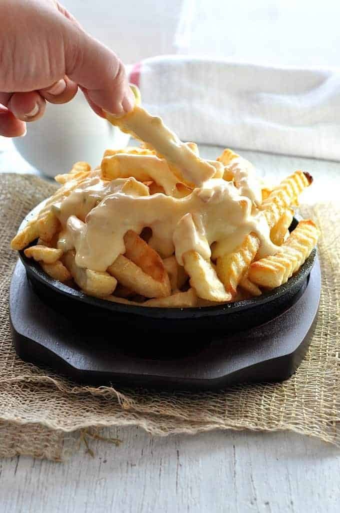 Nachos Cheese Dip & Sauce that does not harden when cooled, and doesn't split when reheated. Just 5 min to make, without using processed cheese! recipetineats.com