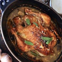 Jamie Oliver's Chicken in Milk in a casserole pot, fresh out of the oven ready for serving.