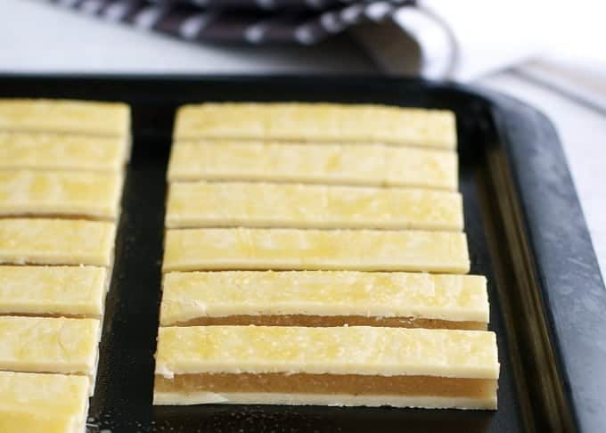 Baked Apple Pie Fries with Salted Caramel Dipping Sauce - everything you love about apple pie, in mini bite size form. Just spread pie filling between pastry, cut and bake. Easy to make, fun to eat!