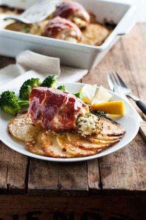 One Pan Prosciutto Wrapped Ricotta Chicken with Scalloped Potatoes - simple to make, elegant enough for company. The chicken adds extra flavor to the golden potatoes!