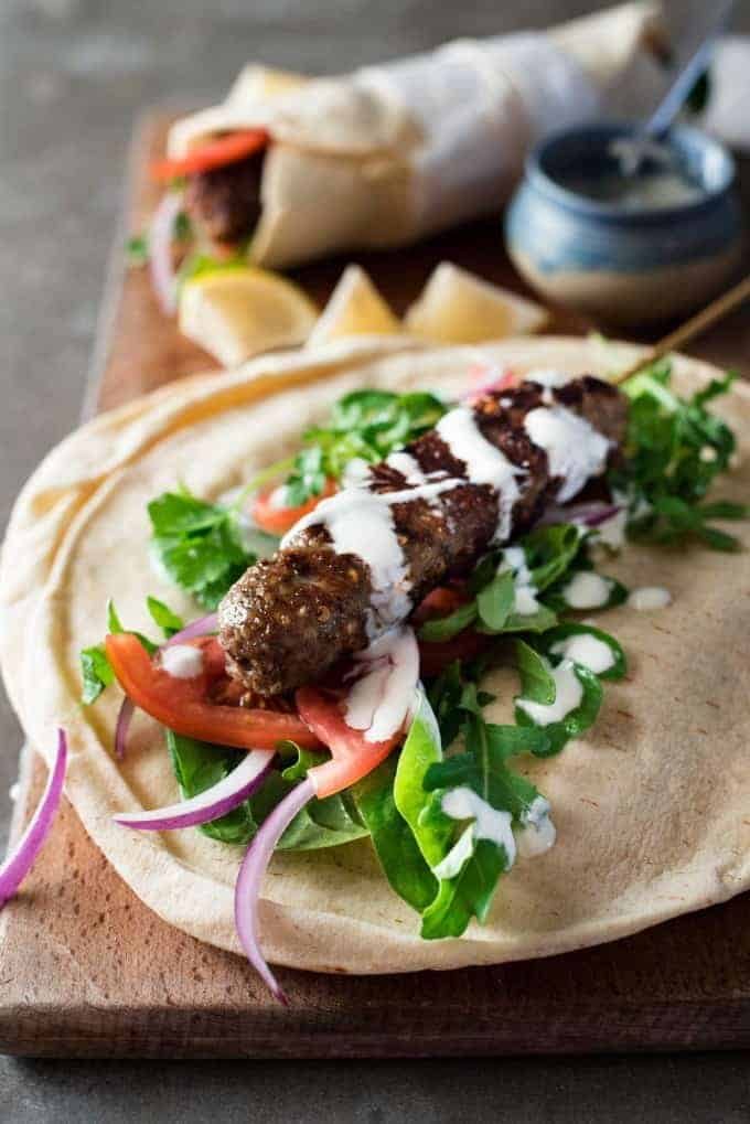 Turkish Lamb Kebab Kofta on pita with vegetables and yoghurt sauce