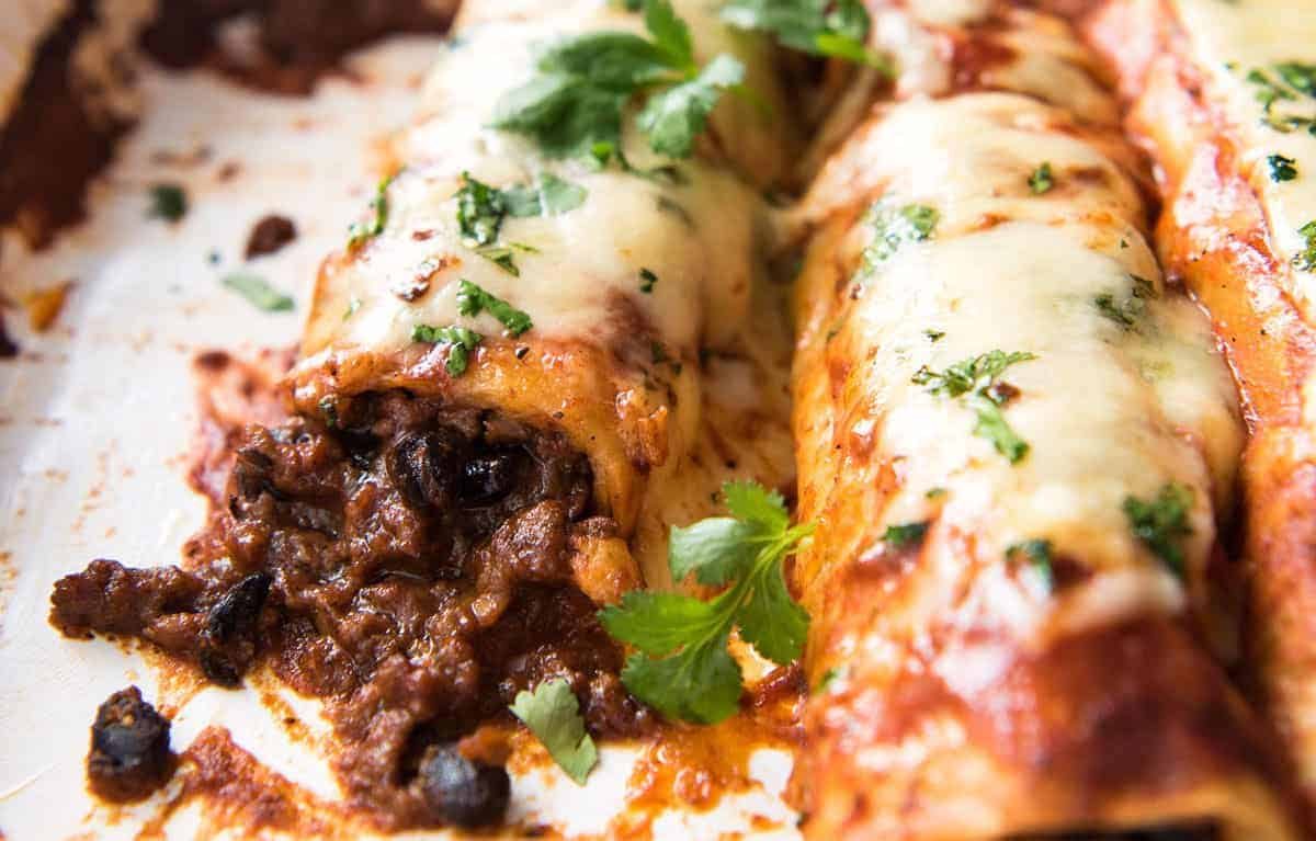 The BEST Beef Enchiladas, with an extra tasty, extra saucy filling and the most incredible homemade Enchilada Sauce! www.recipetineats.com