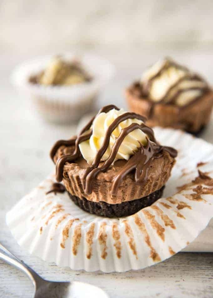 No Bake Nutella Cheesecake - Mini ones made in a muffin tin! A biscuit base and light mousse-like Nutella flavoured cheesecake. Easy to make and completely irresistible! recipetineats.com