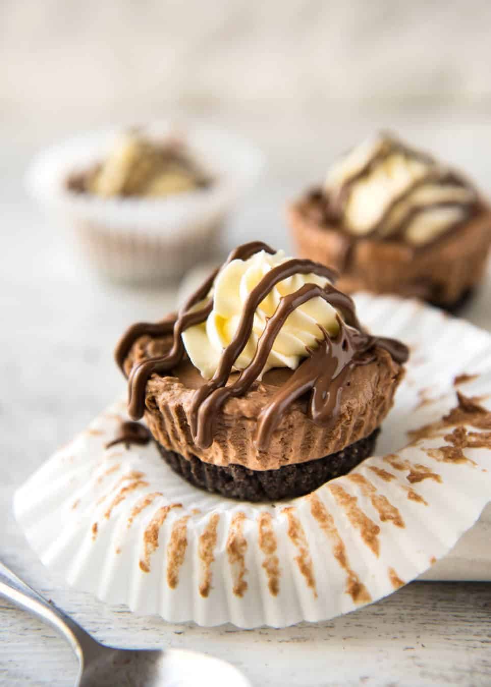 No Bake Nutella Cheesecake - Mini ones made in a muffin tin! A biscuit base and light mousse-like Nutella flavoured cheesecake. Easy to make and completely irresistible! www.recipetineats.com