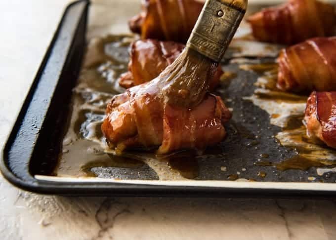 Bacon Wrapped Chicken - A spectacular way to dress up chicken with just a few simple ingredients! Brown sugar is the key to creating a gorgeous glaze on the bacon. recipetineats.com