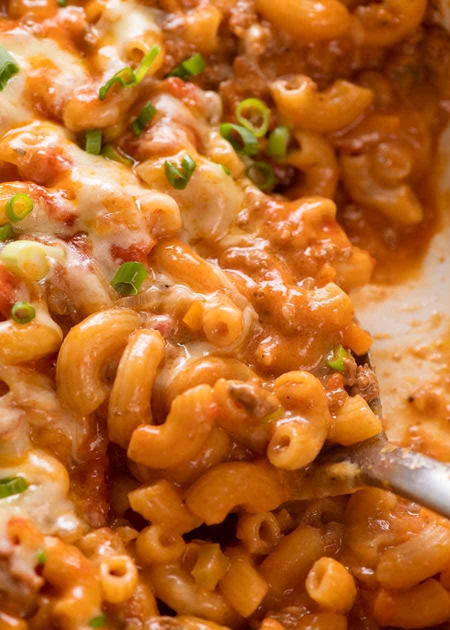 Close up of Cheeseburger Casserole - homemade Hamburger Helper - in a white cast iron skillet, fresh off the stove