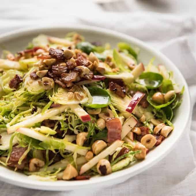 Brussel Sprout Salad - the combination of brussels sprouts, bacon, apple and hazelnuts is a magical combination! recipetineats.com