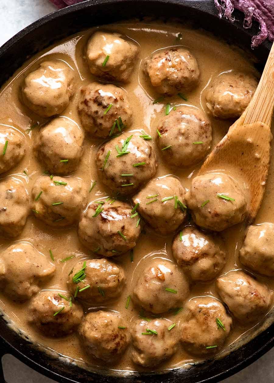 Swedish Meatballs in a skillet with creamy gravy, the traditional Swedish sauce