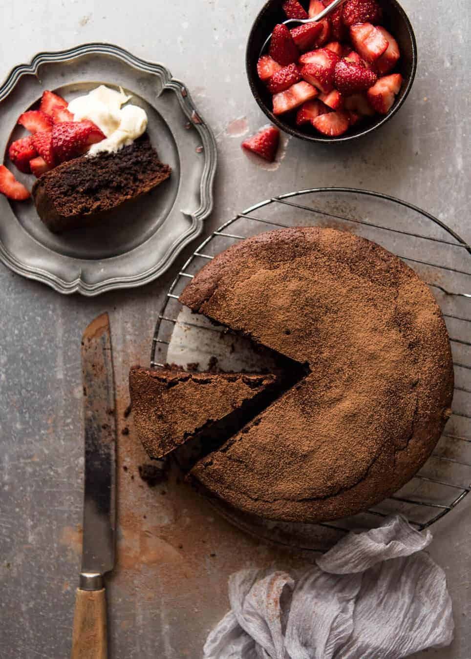 A simple Flourless Chocolate Cake made with almond meal / almond flour. Moist inside, with a thin crackly brownie-like surface. A stunning, very quick cake to make! www.recipetineats.com