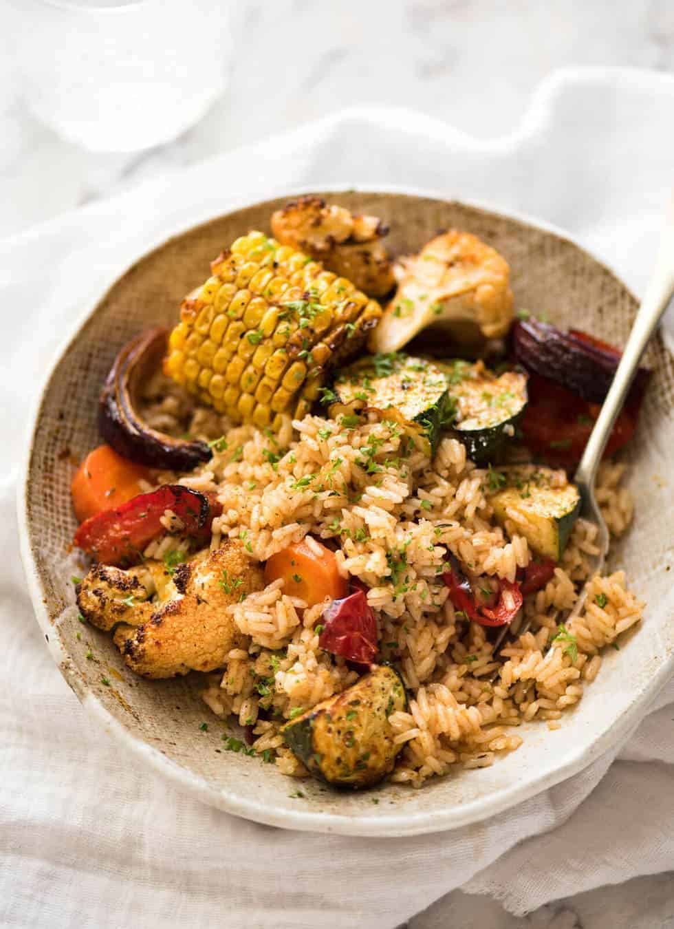 Oven Baked Rice and Vegetables - Fluffy seasoned rice and oven roasted vegetables, all made in ONE pan! Fabulous meal or side, super quick and easy to prep. recipetineats.com