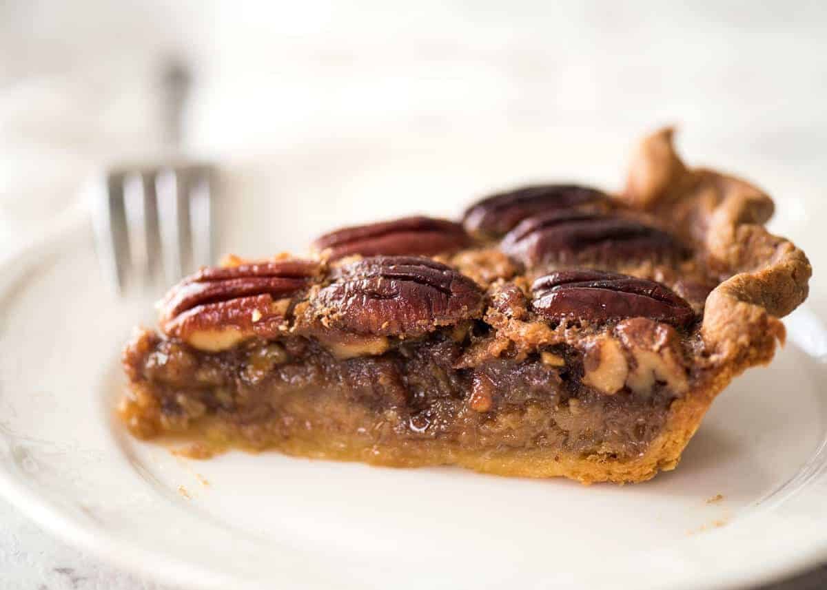 Learn how to make Pecan Pie, the great American classic! Flaky all-butter pie crust with a soft set filling, the quick video tutorial will be very helpful will guide you to nail this every time! www.recipetineats.com