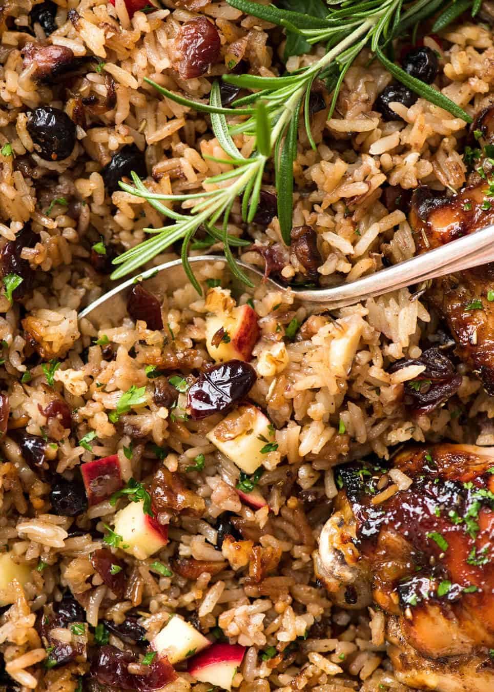 A flavour loaded one-pan, quick midweek dinner - Baked Chicken and Rice Pilaf with Cranberries, Walnuts and Apple. The smell when this is cooking is amazing! www.recipetineats.com