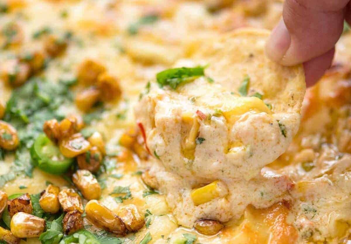 Essential Super Bowl food - a big batch Hot Corn Dip that's made for eating with eyes glued to the TV screen.