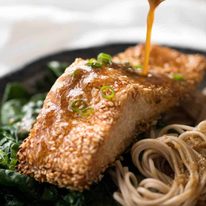 Just roll the salmon in sesame seeds, drizzle with oil and bake! You'll be amazed how well the sesame adheres to the salmon and love how crispy this Sesame Salmon comes out!