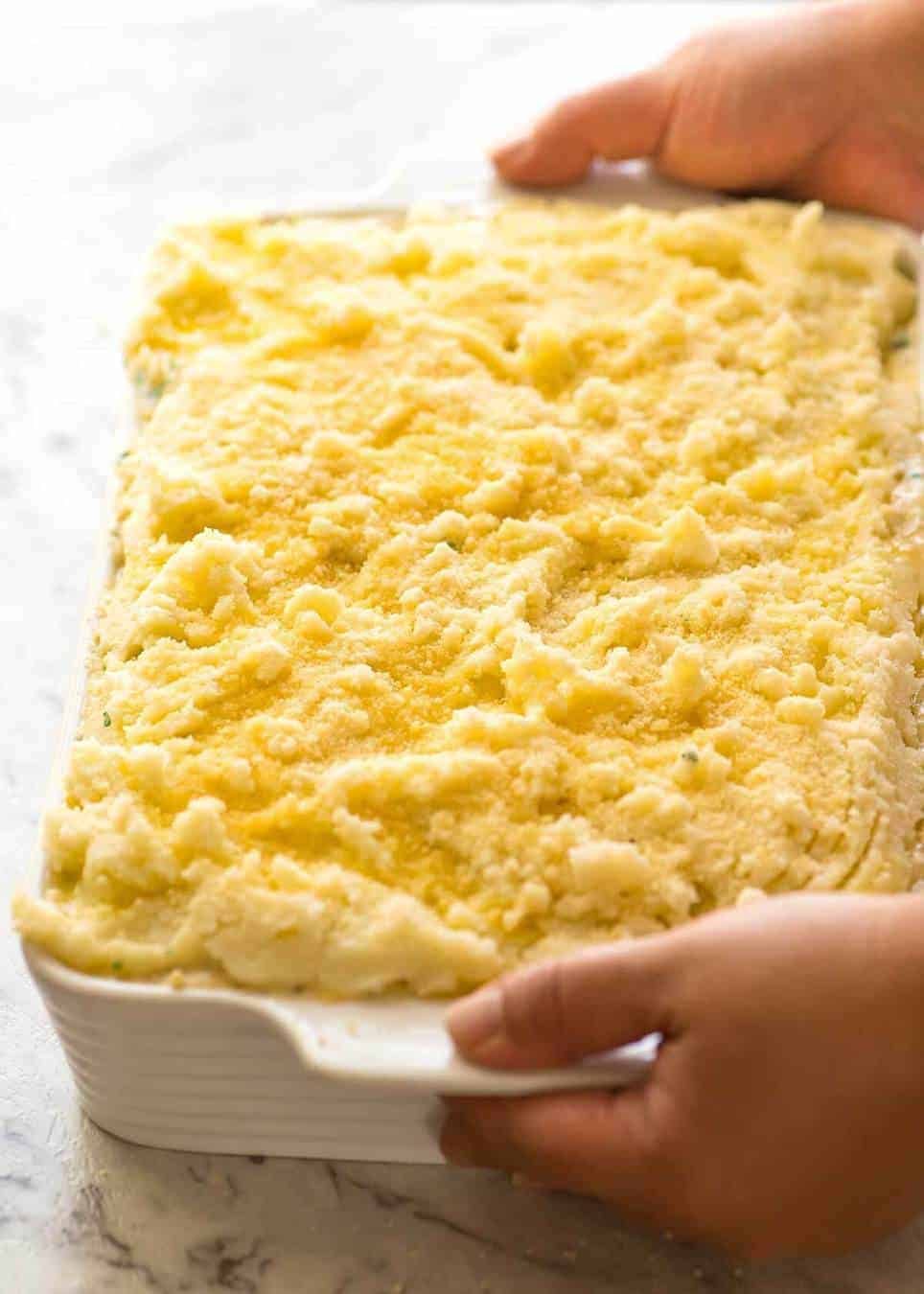 Fish Pie in white baking dish ready to go into oven