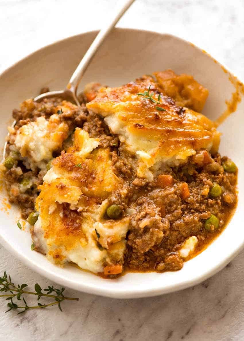 Shepherd's Pie in a rustic bowl with a spoon, ready to be eaten