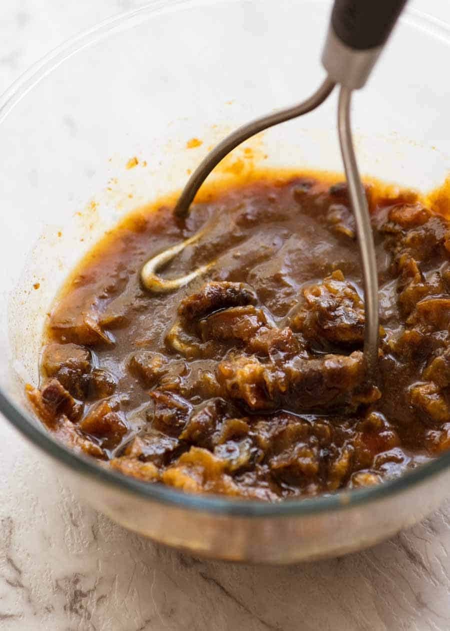 Dates being mashed for Sticky Date Pudding