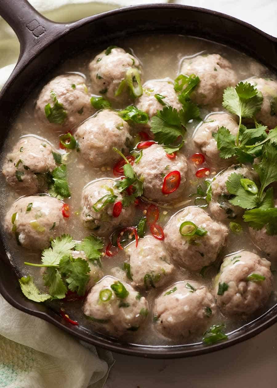 Overhead close up photo of Vietnamese Pork Meatballs for Banh Mi Vietnamese Sandwich in a black skillet