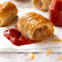 Close up of Sausage Rolls with tomato sauce