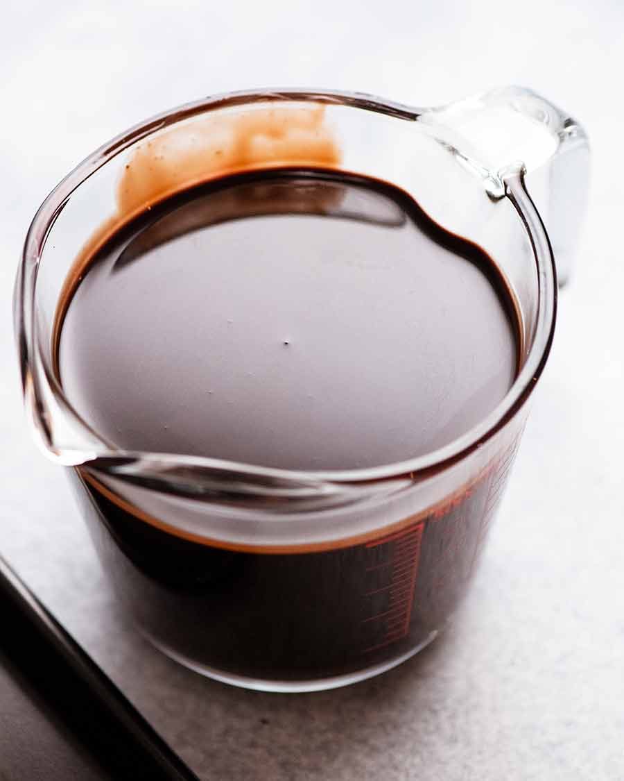 Jug of Chocolate Mirror Glaze, ready to be poured