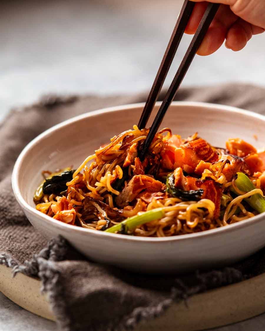 Chopsticks picking up Teriyaki Salmon Noodles
