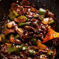 Beef in black bean sauce in a wok