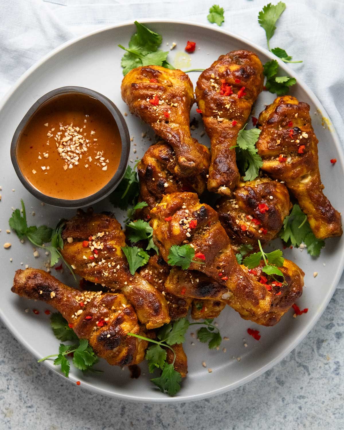 Satay chicken legs with peanut sauce